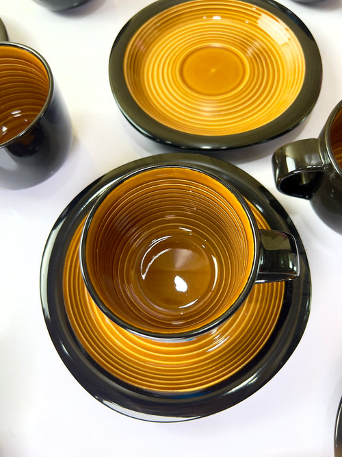 Amber Noir Cups And Saucers Set
