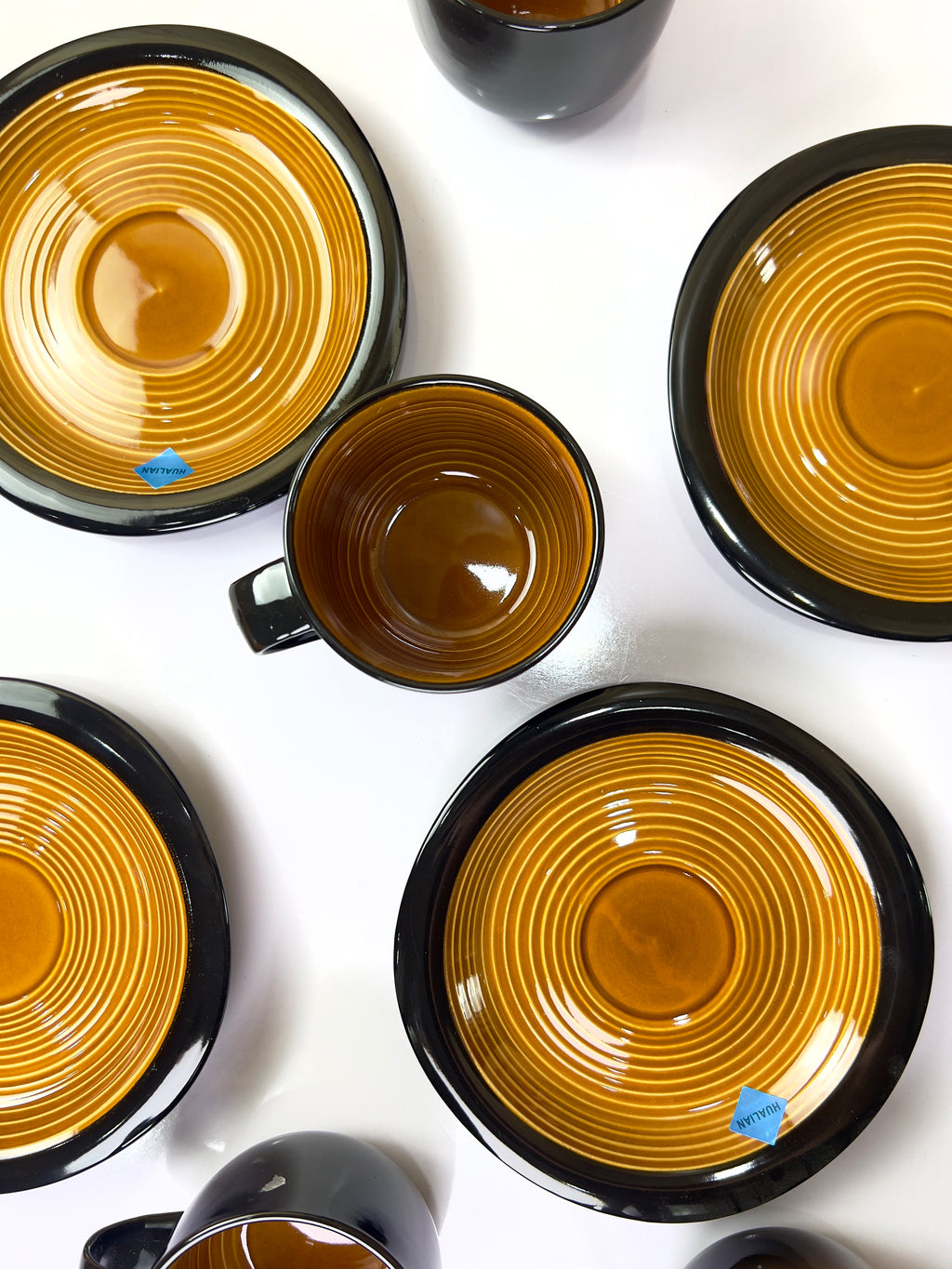 Amber Noir Cups And Saucers Set
