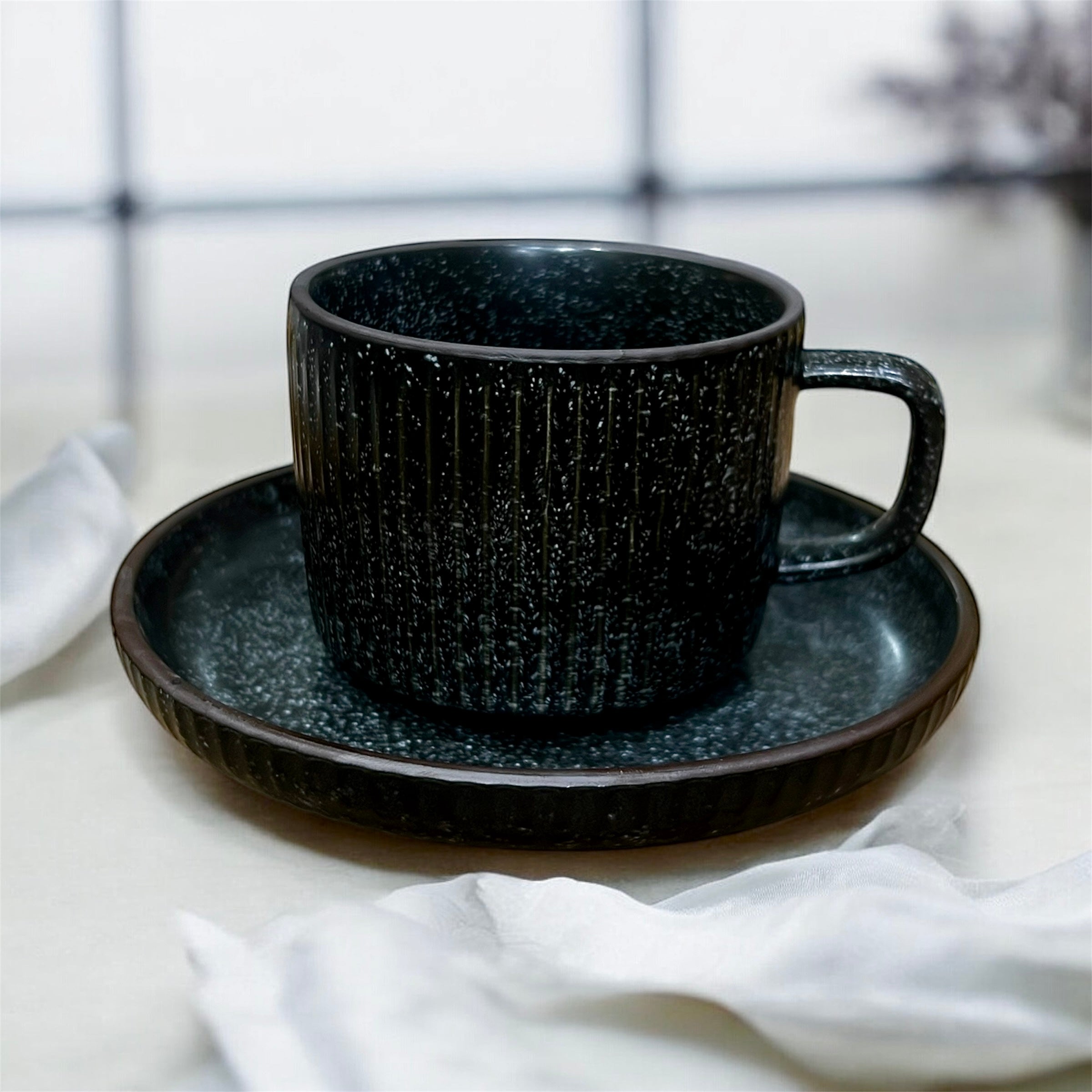 Noir Stoneware Cups And Saucers