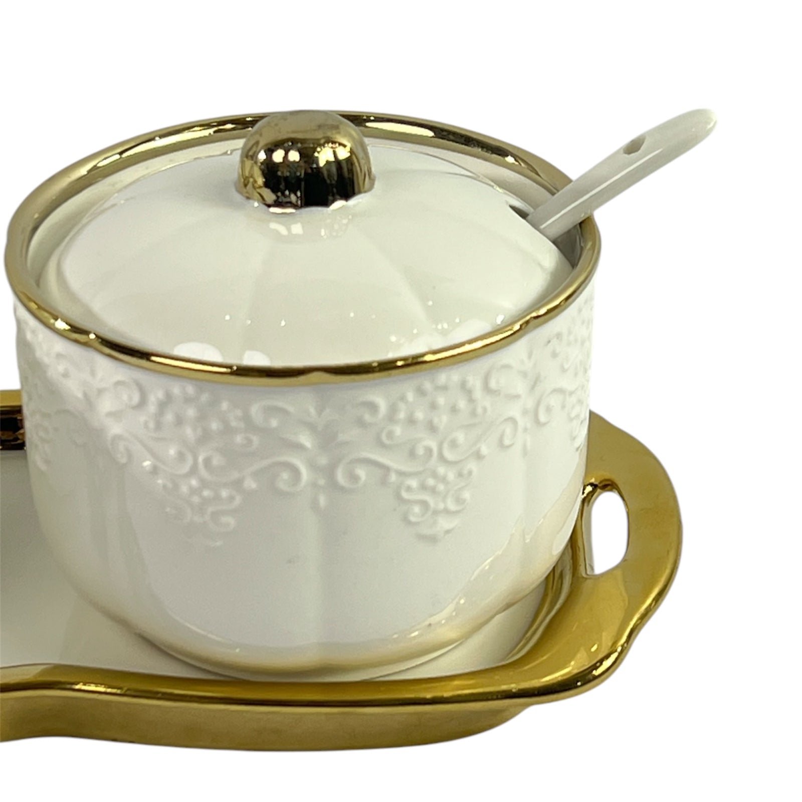 Golden and white teapot